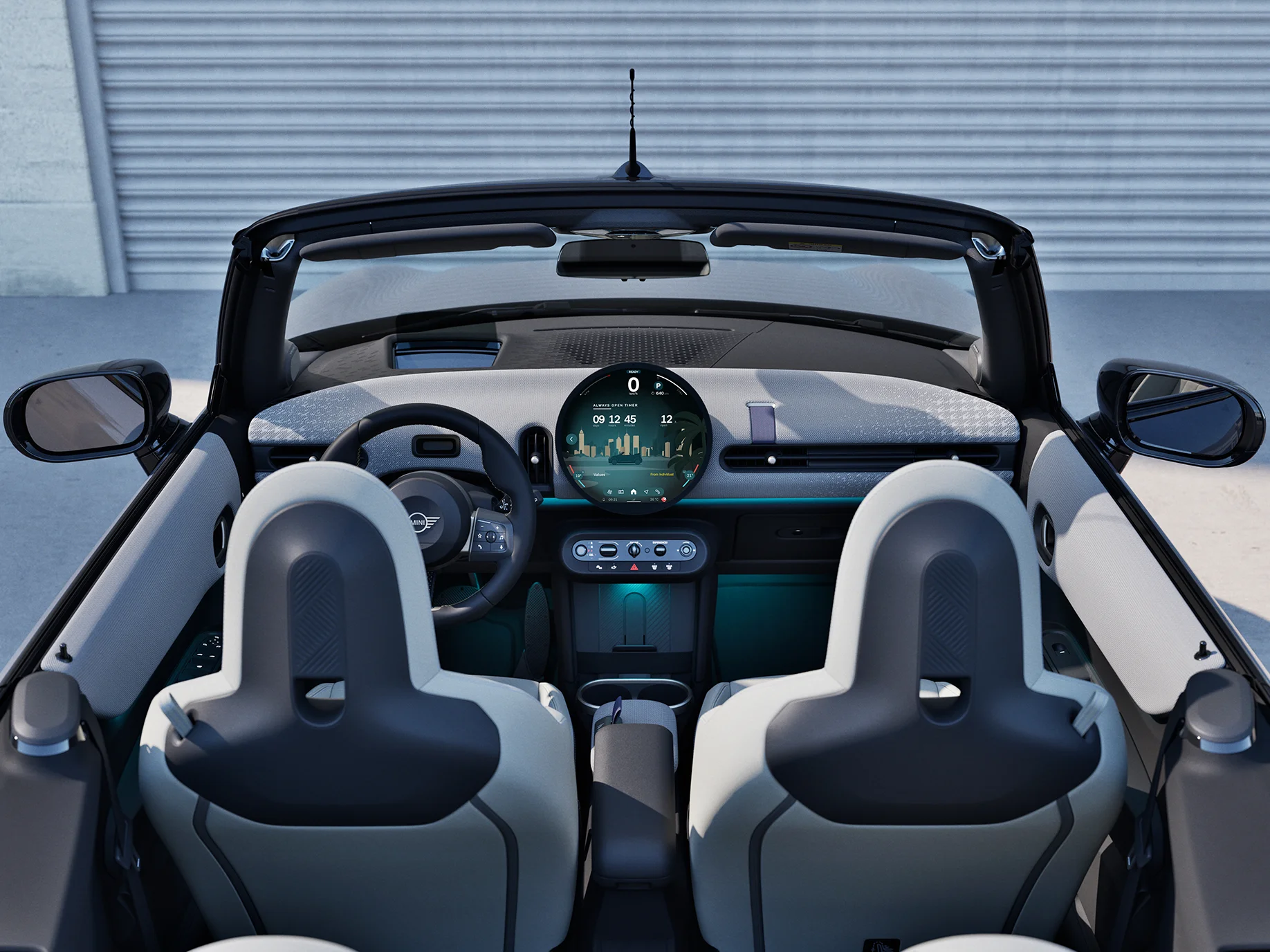 Πίσω όψη του εσωτερικού του MINI Cooper Cabrio με εστίαση στον πίνακα οργάνων και τη μονάδα Interaction.