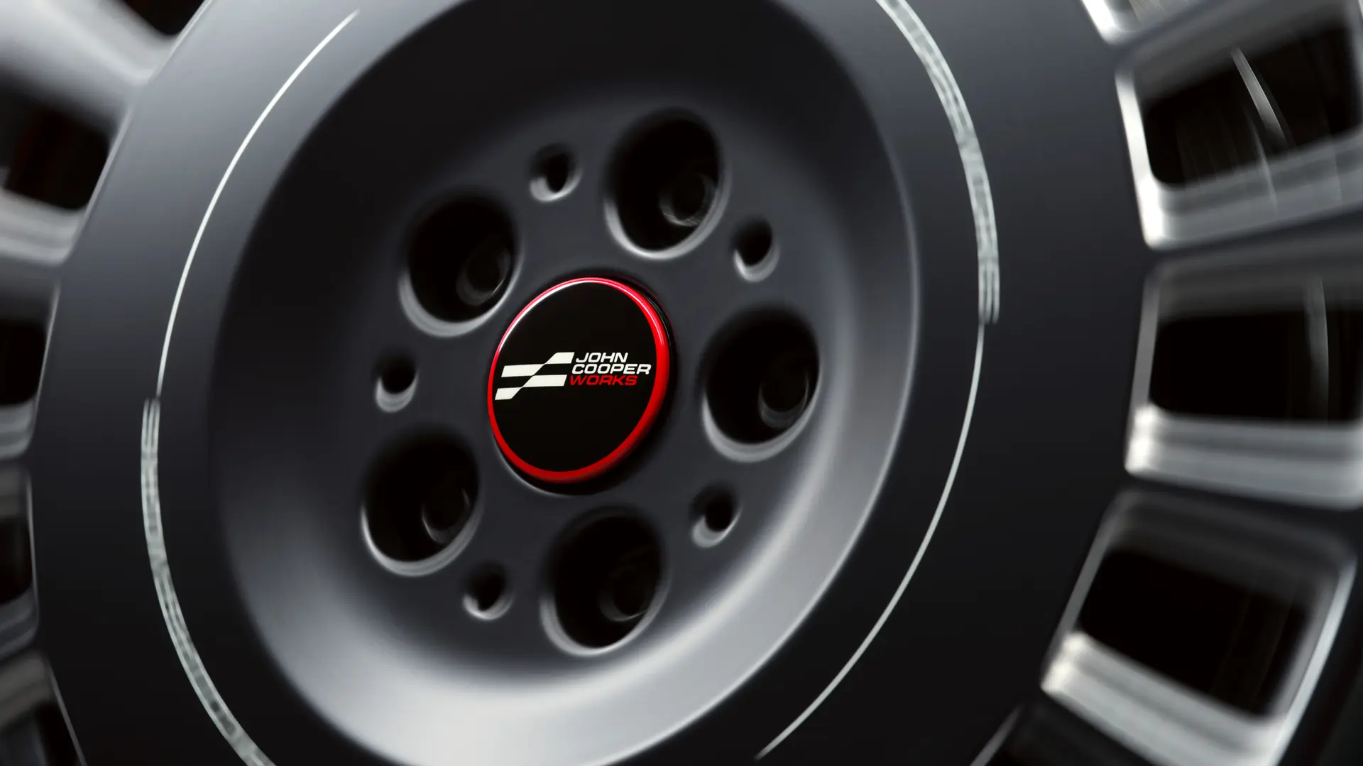 Το μη περιστρεφόμενο καπάκι ζάντας John Cooper Works δεν περιστρέφεται μαζί με τον τροχό αλλά παραμένει σταθερό σε οριζόντια θέση όταν το αυτοκίνητο κινείται. 